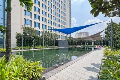 a swimming pool in the middle of a building at Contemporary Apartment KL with 3 Bedrooms in Kuala Lumpur