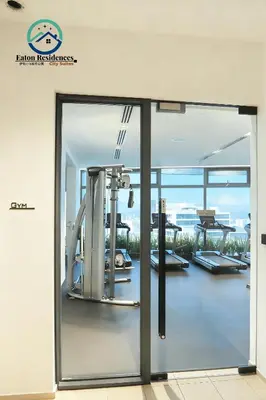a glass door in a building with a view at Eaton Residence City Suites in Kuala Lumpur