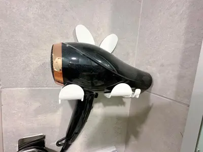 a black and white hairdryer on a wall at KL Sentral Monorail 4 pax Kuala Lumpur, Sky Pool Family Merdeka 118 Nice View in Kuala Lumpur