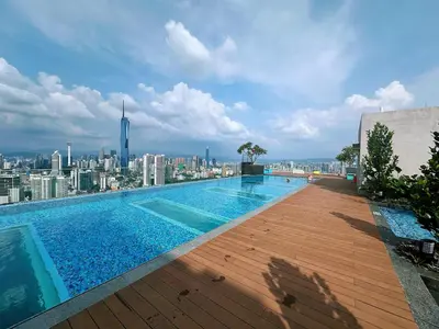a swimming pool on top of a building with a city at KL Sentral Monorail 4 pax Kuala Lumpur, Sky Pool Family Merdeka 118 Nice View in Kuala Lumpur