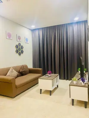 a living room with a couch and a table at Kuala Lumpur Sky Suites KLCC in Kuala Lumpur