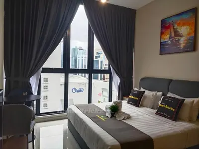 a bedroom with a bed with a teddy bear on it at Majestic Residence Suites KLCC by Homebrickz in Kuala Lumpur