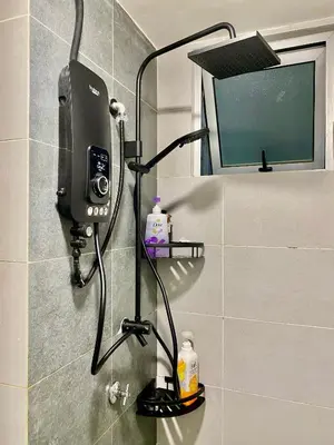 a soap dispenser on the wall of a bathroom at RSJ Homestay at Setapak - 2 Room in Kuala Lumpur