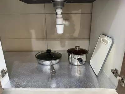 a kitchen counter with two pans and a sink at SV001 Maluri - Sunway Velocity - Cheras Stay in Kuala Lumpur
