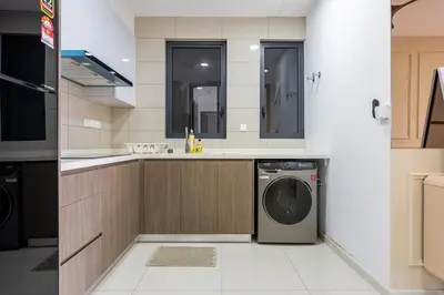 a kitchen with a washing machine and a sink at SV001 Maluri - Sunway Velocity - Cheras Stay in Kuala Lumpur