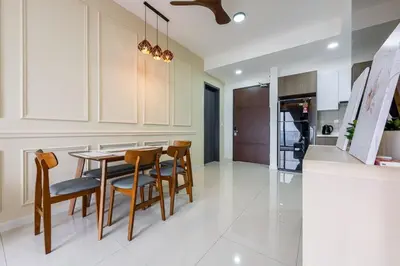 a kitchen with a table and chairs in a room at SV001 Maluri - Sunway Velocity - Cheras Stay in Kuala Lumpur