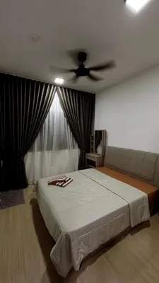 a bedroom with a bed and a ceiling fan at M Arisa Sentul City View Condo in Kuala Lumpur