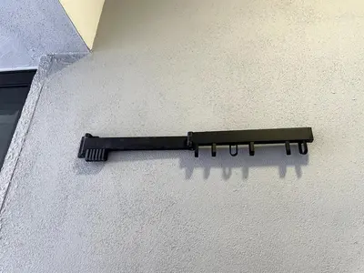 a black brush on the side of a wall at Trion KL SkyLoft in Kuala Lumpur