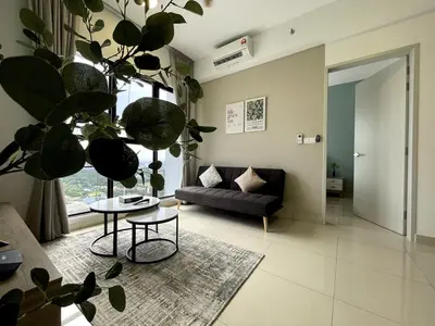 a living room with a couch and a table at Trion KL SkyLoft in Kuala Lumpur