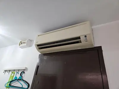 a toaster oven on top of a refrigerator at VG Homes in Kuala Lumpur