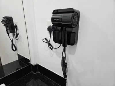 a phone is attached to a wall in a bathroom at VG Homes in Kuala Lumpur