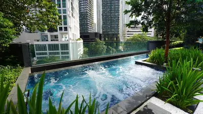 a swimming pool in the middle of a city at Star KLCC Comfort Suite 3-4pax in Kuala Lumpur