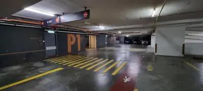 an empty parking garage with yellow lines on the floor at Star KLCC Comfort Suite 3-4pax in Kuala Lumpur