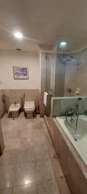 a bathroom with a tub and a toilet and a sink at KL Heart Suite at berjaya Times Square in Kuala Lumpur