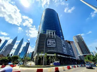 a tall blue building with a sign on it at Cozy Stay at Legasi 5 min Walking distance to KLCC 2 in Kuala Lumpur