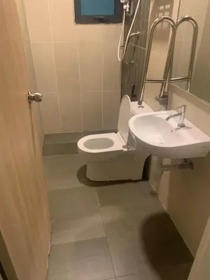 a bathroom with a toilet and a sink at Cozy Stay at Legasi 5 min Walking distance to KLCC 2 in Kuala Lumpur