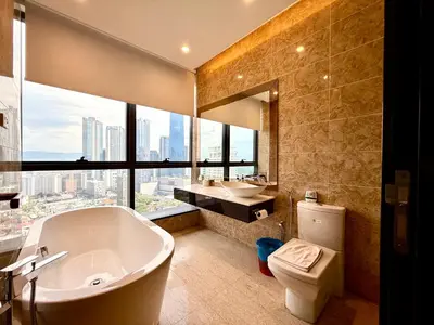 a bathroom with a tub and a sink and a toilet at Dorsett Luxury KLCC by IHG in Kuala Lumpur