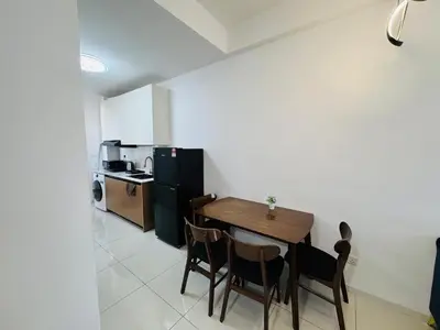a kitchen and dining room with a table and chairs at Majestic Residence Kuala Lumpur City Centre in Kuala Lumpur