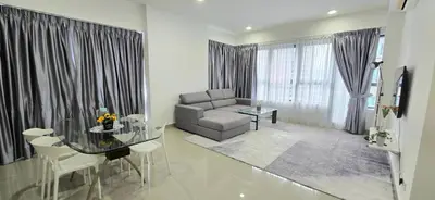 a living room with a couch and a glass table at KLCC City View Retreat Cozy Spacious Apartment 2BR 2BTH in Kuala Lumpur