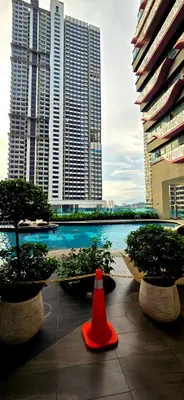 a red cone sitting in front of some buildings at KLCC City View Retreat Cozy Spacious Apartment 2BR 2BTH in Kuala Lumpur