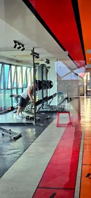 a man is working on a plane in a gym at KLCC City View Retreat Cozy Spacious Apartment 2BR 2BTH in Kuala Lumpur