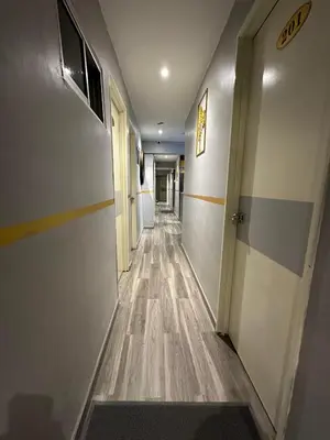 an empty hallway with a long corridor at SS Grey House Bukit Bintang KL in Kuala Lumpur