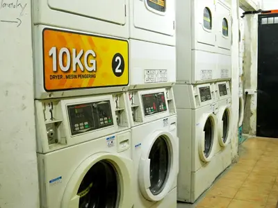 a group of washing machines in a laundromat at Mingle Lekiu in Kuala Lumpur