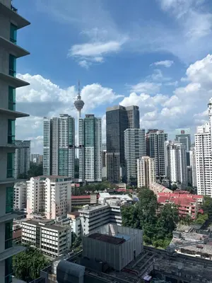 a view of a city with tall buildings at Stay Haven at Swiss Garden in Kuala Lumpur