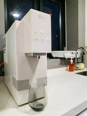 a machine sitting on a counter with a glass at La Gente x Agile Bukit Bintang TRX Pavilion KL in Kuala Lumpur