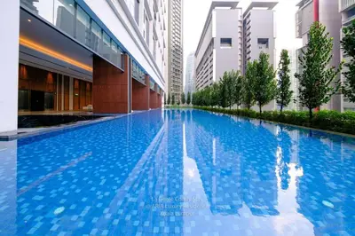 a swimming pool in the middle of a building at 2R2B KLCC ARIA Hi Luxury Amazing Facilities ZEN in Kuala Lumpur