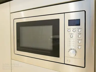 a microwave oven is shown in a kitchen at 2R2B KLCC ARIA Hi Luxury Amazing Facilities ZEN in Kuala Lumpur