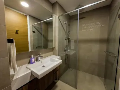 a bathroom with a sink and a shower at 2R2B KLCC ARIA Hi Luxury Amazing Facilities ZEN in Kuala Lumpur