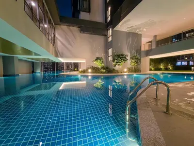 a swimming pool in the middle of a building at 3BR Sunway Velocity 2 TRX KLCC in Kuala Lumpur