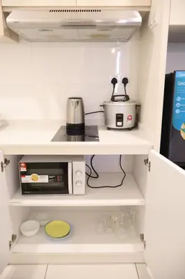 a kitchen pantry with a microwave and a toaster at COZY KenwingstonThe platz Trail 3BR&2BR For 8PAX wifi free Parkin nice view 1902 in Kuala Lumpur