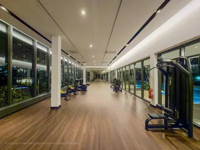a gym with treadmills and exercise equipment in a building at 4R3B Luxe KLCC Embassy Pavilion 600MBPS Gas cook in Kuala Lumpur