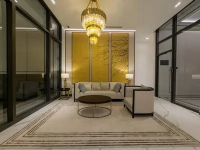 a living room with a couch and a chandelier at 4R3B Luxe KLCC Embassy Pavilion 600MBPS Gas cook in Kuala Lumpur