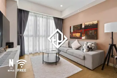 a living room with a couch and a table at OOAK 2BR - Mont Kiara Garden international school in Kuala Lumpur