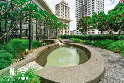 a small pond in a city with tall buildings at OOAK 2BR - Mont Kiara Garden international school in Kuala Lumpur