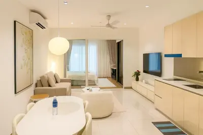 a living room with a couch and a table at Quill Residences Klcc By AB in Kuala Lumpur