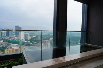 a balcony with a view of a city at Luxury Suites Lucentia Residence KLCC at BBCC in Kuala Lumpur