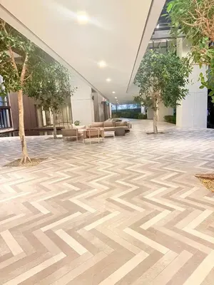 a large lobby with a wooden floor in a building at Luxury Suites Lucentia Residence KLCC at BBCC in Kuala Lumpur