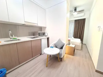 a small kitchen and a table in a room at Agile Residensi Service Apartment Kuala lumpur in Kuala Lumpur