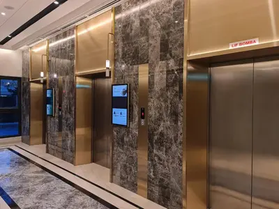 a lobby with elevators in a building at Agile Residensi Service Apartment Kuala lumpur in Kuala Lumpur