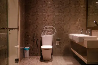 a bathroom with a toilet and a sink at Dorsett Hartamas KL, Bathtub Smart TV & WiFi in Kuala Lumpur