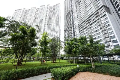 a park with trees and buildings in a city at M Vertica KL City Residences by Vivid Stay in Kuala Lumpur