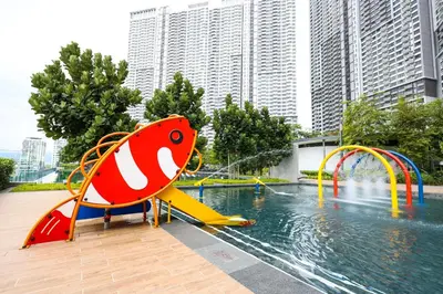 a pool with a water park with a playground at M Vertica KL City Residences by Vivid Stay in Kuala Lumpur