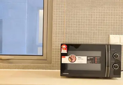 a microwave oven sitting on a counter in a kitchen at Bintang Fairlane Bukit Bintang #121 near Pavilion KLCC Kuala Lumpur in Kuala Lumpur