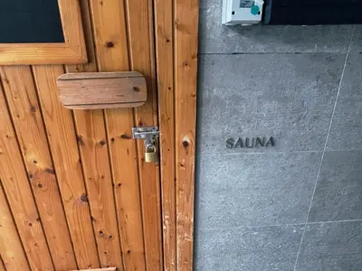 a wooden door with the word sauna written on it at KLCC Bukit Bintang Anggun Residence 5min walk to Monorail station in Kuala Lumpur