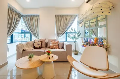 a living room with a couch and a table at Blossom Playground with kids friendly home Arte Plus in Kuala Lumpur