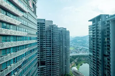 a view of some tall buildings and a river at Blossom Playground with kids friendly home Arte Plus in Kuala Lumpur